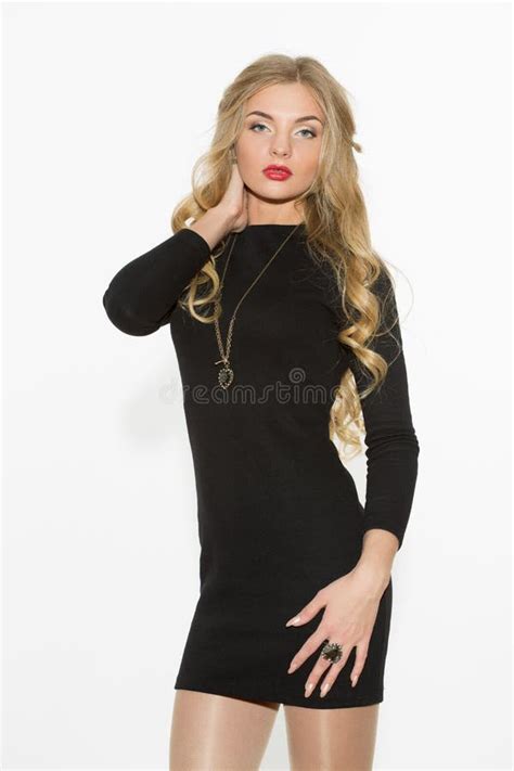 Fashionable Curly Blonde With Bright Makeup Sexual Arousal Girl In A Short Dress Isolated On