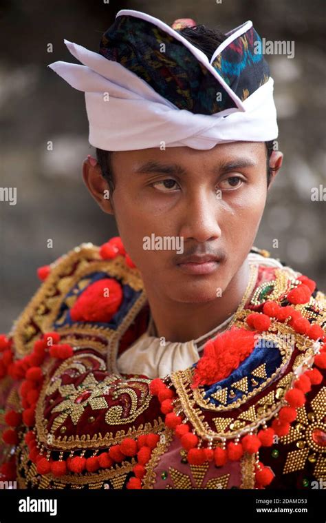 Young Balinese Man In Festive Dance Wear For Temple Ceremonial Dance