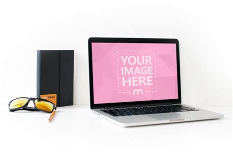 Free Macbook On Table Online Mockup - Mediamodifier
