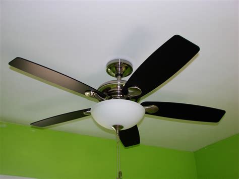 With the light fixture now wired and attached, reattach the center plate to the body of the fan. Whole-Home Light Fixture & Ceiling Fan Installation ...