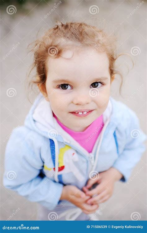 Little Girl With Beautiful White Teeth Smiling At The Camera Stock
