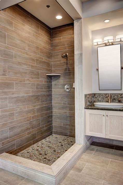 Tile that looks like wood is called wood look tile, wood grain tile, wood plank tile, etc. modern shower with wood tile … | Tiny house bathroom ...