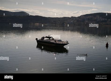 An Old Fishing Boat In The Lake During Sunset In The City Of Kastoria
