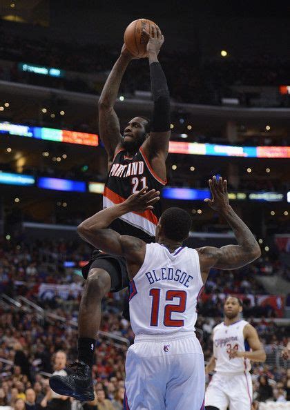 Jj Hickson 21 Of The Portland Trail Blazers Goes In For A Dunk Past