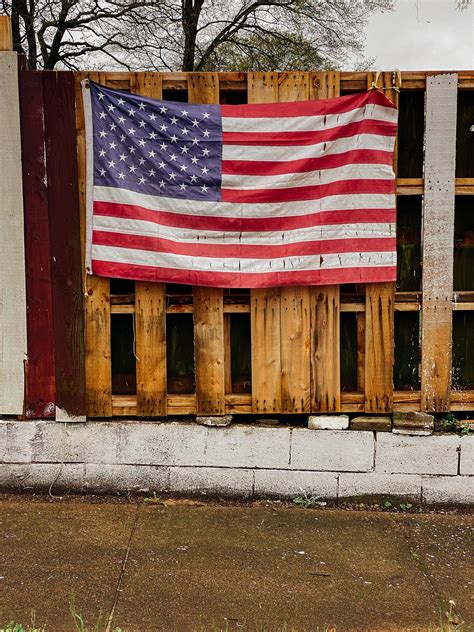 American Flag Hanging On Wooden Fence · Free Stock Photo