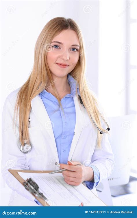 Young Woman Doctor At Work In Hospital Office Blue Color Blouse Of