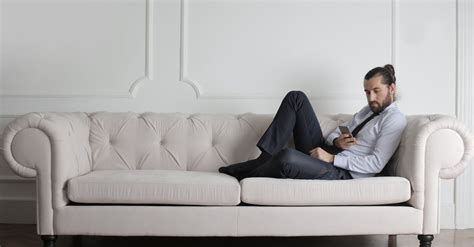 Photo Of Man Sitting On Couch · Free Stock Photo