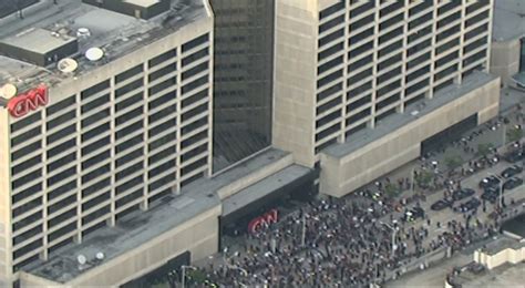 Protesters In Atlanta Mount Cnn Sign And Raise Black Lives Matter Flag