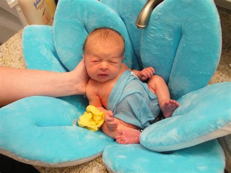 Many baby bathtubs fit in sinks, but not all baby bathtubs are shaped like flowers. My Random Life Story: First Bath