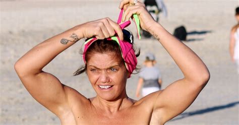 danniella westbrook whips off bikini top to give an eyeful of her curvy bod as she relaxes on