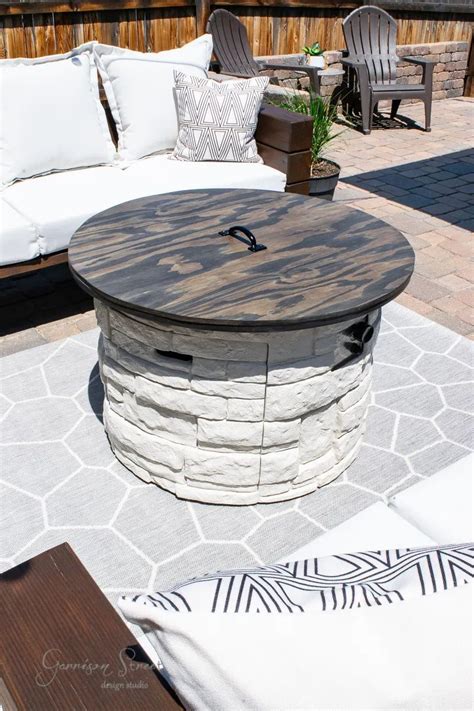 Make a portable propane fire pit out of a flower pot. DIY Fire Pit Makeover with Wood Cover - Garrison Street ...