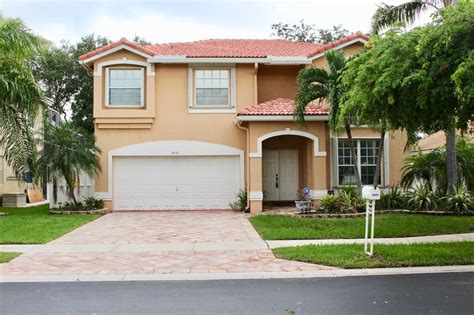 This beach house features the most surprisingly awesome color. Beautiful house for sale in Sunrise, Florida. | Florida home, Florida living, Florida