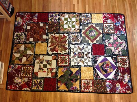 A Patchwork Quilt Is Laying On The Floor