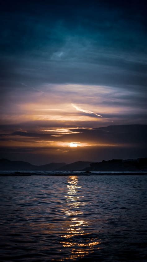 Download Wallpaper 938x1668 Water Sea Sunset Ripples Horizon