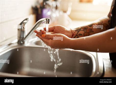 Washing Your Hands Is The Way To Good Health A Woman Washing Her Hands