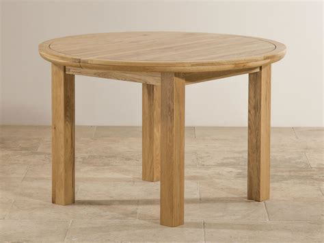 A few marks on the table and a couple of the chairs. Knightsbridge Natural Solid Oak 4ft Round Extending Dining ...