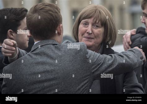 Ben Pocock's mother Louise embraces a fellow mourner after his funeral