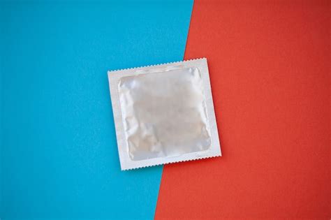 premium photo condom top view birth control pill safe sex healthcare concept