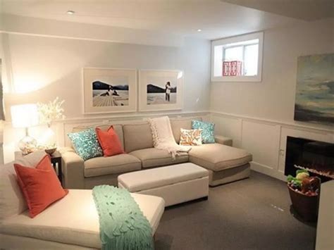 A Living Room With Couches Chairs And Pictures On The Wall In Its Corner
