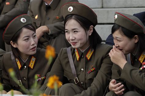 three north korean female soldiers enjoying a chuckle r pics