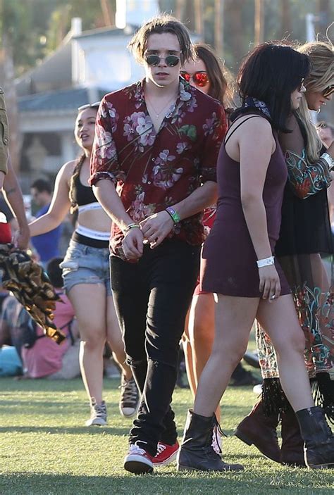 Brooklyn Beckham Transforms Again At Coachella With Messy Braided Hair And Hawaiian Shirt