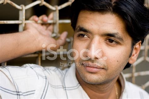 Outdoor Portrait Of Young Pensive Indian Asian Attractive Handso Stock