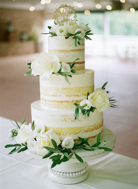 White 3 Tier Wedding Cake With White Flowers At Missouri Wedding Venue