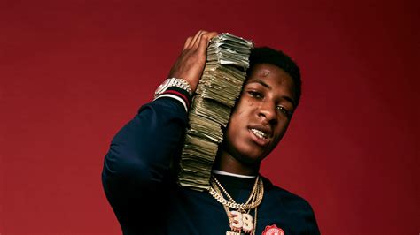 Nba Youngboy In Red Background With Money Bundle On Neck