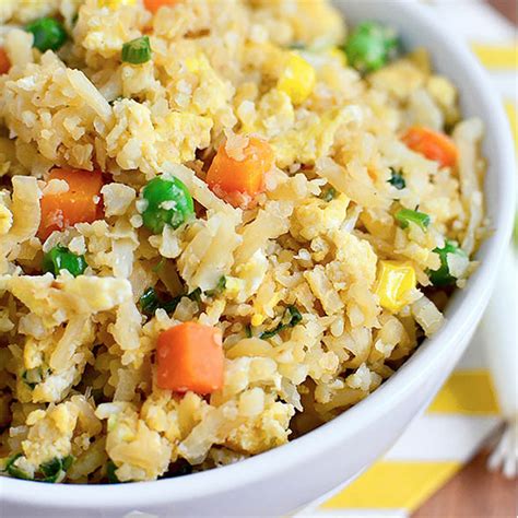 Add in the cauliflower rice, salt and chopped tomatoes, cover with a lid and cook for another 5 to 7 minutes until the cauliflower rice has begun to soften in texture. Cauliflower Fried Rice (Video) - Iowa Girl Eats