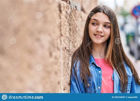 Adorable Girl Smiling Confident Looking To The Side At Street Stock