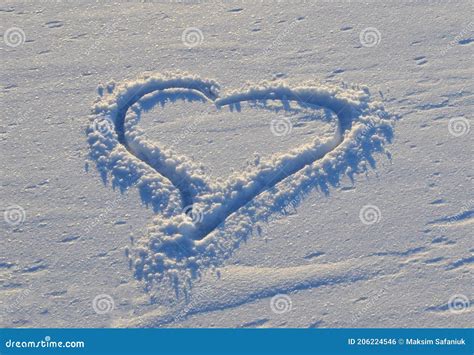 Heart Shape Drawn On A Snow Background Love Concept Stock Photo