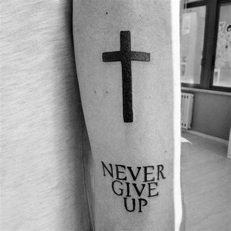Those words work in so many different situations, which is why it is one of very few tattoo designs that just about anyone can get. 60 Never Give Up Tattoos For Men - Phrase Design Ideas