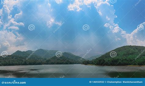 Reservoir With Surrounding Mountains And Beautiful Skies In Thailand