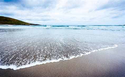 Small Ocean Sea Waves On Sandy Beach In Calm Weather Stock Photo