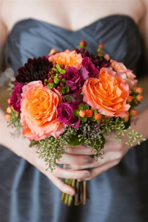Plum and pumpkin fall wedding inspiration pumpkin decor orange and purple wedding invites pumpkin favors wedding favor ideas wedding party blog. orange and plum bouquet against slate gray wedding dress ...