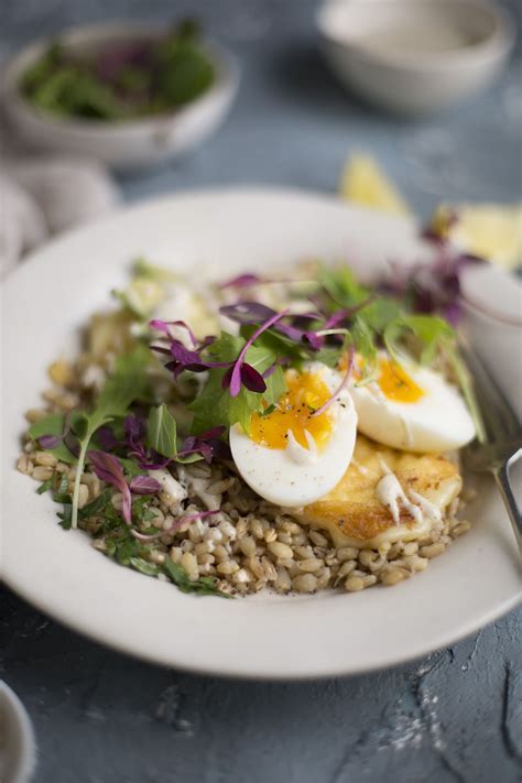 barley breakfast bowl with halloumi, avocado, egg & tahini ...