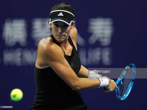 Garbine Muguruza Of Spain Returns A Shot To Anastasija Sevastova Of