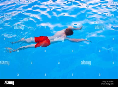 Boy Diving In The Pool Stock Photo Alamy