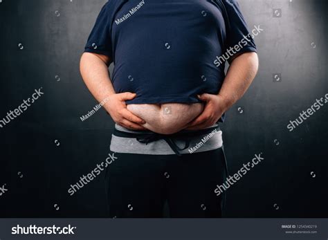 Fat Man Big Belly On Dark Stock Photo 1254340219 Shutterstock