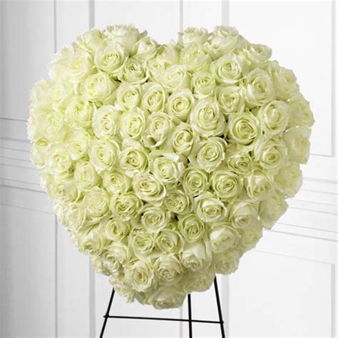 Shop white rose casket flowers, standing sprays, fireside baskets and other funeral service flowers available for delivery to funeral homes in oceanside, east rockaway and all of long island from flowers by mike. White Rose Heart Flower Spray at Send Flowers