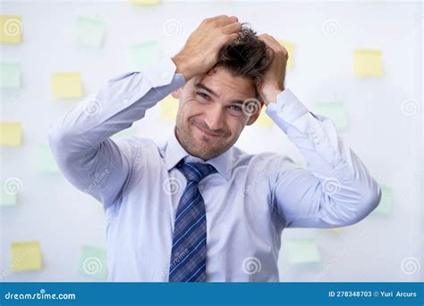 Pulling Your Hair Out A Frustrated Young Businessman In The Office