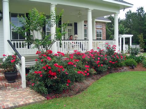 A Southern Belle Dishes on Decor: My Life on the Front Porch A flower bed in front of house best flower bed weed barrier.
