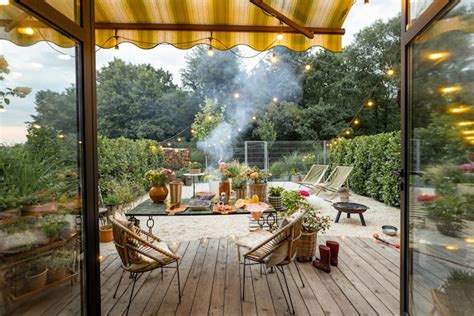 Premium Photo Atmospheric And Cozy Garden With Dining Place At Dusk