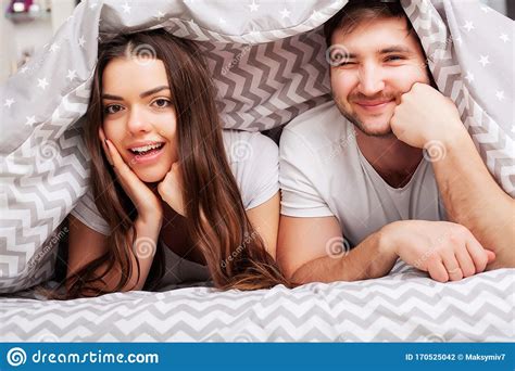Happy Couple Having Fun In Bed Intimate Sensual Young Couple In