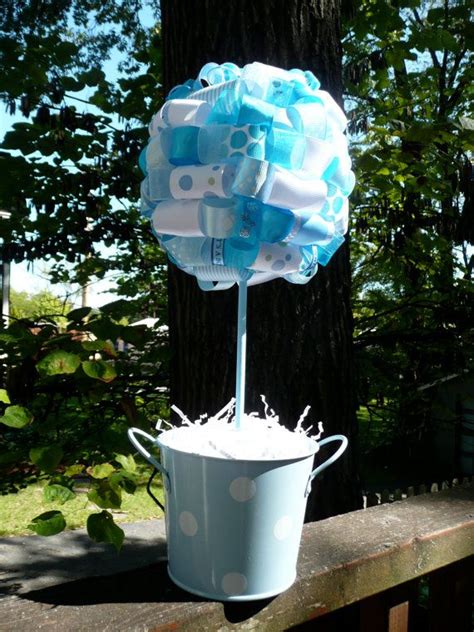 This cute baby bottle will look adorable on display at your drink station, snack table, and even your dinner table. It's A Boy Baby Blue and White Ribbon Centerpiece Topiary ...