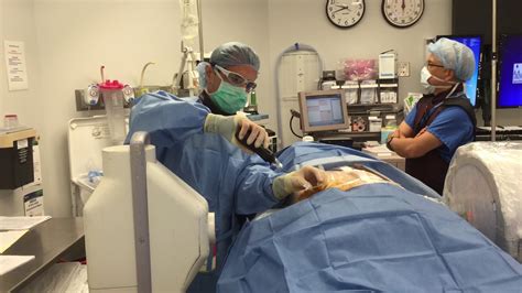Minimally Invasive Dr Koppel Performing A Percutaneous Disk