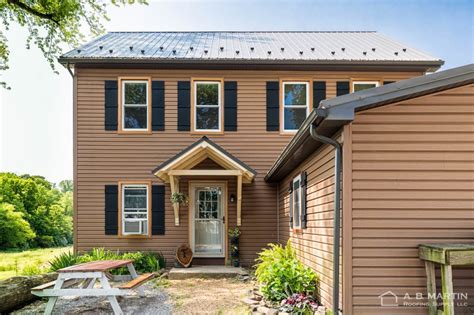 Cmg's steel coil in copper penny was used to complete this roof. Amazing Farmhouse Remodel with a Bronze Metal Roof and ...