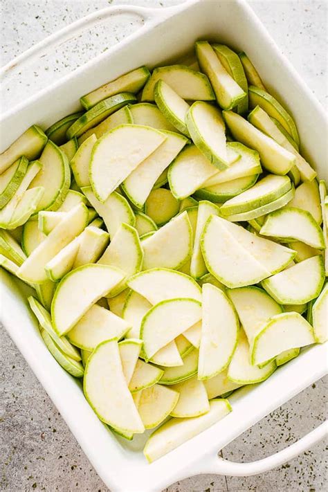 In a greased casserole dish, layer the zucchini on the bottom and pour the chicken and cheese mixture on top. Cheesy Zucchini Casserole (Low Carb & Keto-Friendly ...