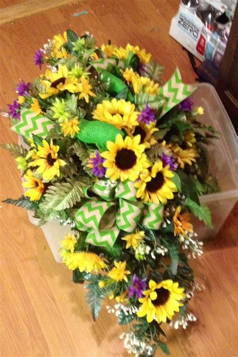 Take a little ornamental threat as … Summer Sunflower Saddle for headstone. Flower arrangement ...