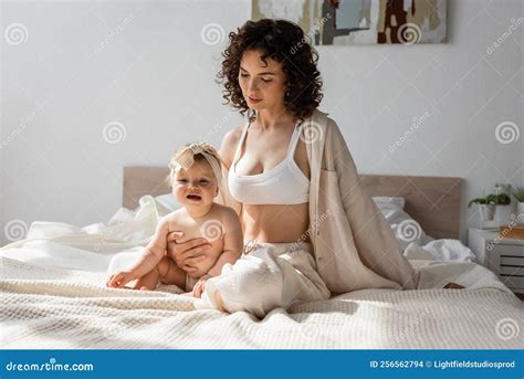 Curly Mother In Loungewear With Crop Stock Photo Image Of Caucasian Attractive